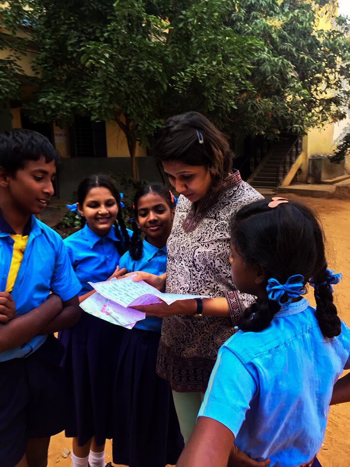 Schoolchildren in blue uniforms in a scene outdoors